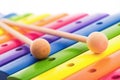 Rainbow colored wooden toy xylophone texture against white background Royalty Free Stock Photo