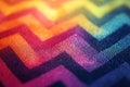 Rainbow colored zigzag pattern creating a vibrant design on woven fabric, ideal for backgrounds and textile projects Royalty Free Stock Photo