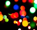 Rainbow colorful blur christmas lights background.abstract Lights unfocused blur light dots black Royalty Free Stock Photo