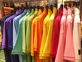 Rainbow or colorful polo shirts on hanger in shopping mall Royalty Free Stock Photo