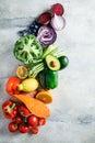 Rainbow colors vegetables and berries background, top view. Detox, vegan food, ingredients for juice and salad