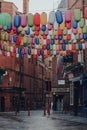 Rainbow coloured lanterns on an empty street in Chinatown, London, UK