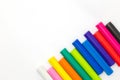 Rainbow coulor modelling clay sticks on white background Royalty Free Stock Photo