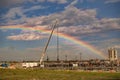 Rainbow Covering a Crane and oil and gas location. Oil and Gas pride Royalty Free Stock Photo