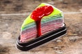 Rainbow crape cake with strawberry sauce Royalty Free Stock Photo