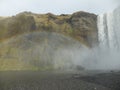 Rainbow created by mist coming from SkÃÂ³gafoss waterfall, Iceland