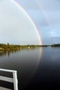 Rainbow from the deck, Lake of the Woods, Kenora, Ontario Royalty Free Stock Photo