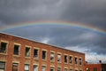A rainbow develops over an office building Royalty Free Stock Photo