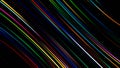 Rainbow diagonal lines shimmer on black background. Motion. Beautiful rainbow lines twinkle like at disco. Multi-colored Royalty Free Stock Photo