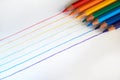 A rainbow drawn with red, orange, yellow, green, blue, indigo, and violet colored pencils.