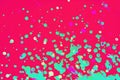 Rainbow drops and streaks of light green paint on a pink background. Art image. Abstraction