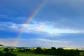 rainbow in the Eifel sky with evening light in summer Royalty Free Stock Photo