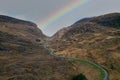 Rainbow at the end of the road at the Black Valley on an autumn morning, located in county Kerry, south of the Gap of Dunloe Royalty Free Stock Photo