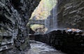 rainbow falls at watkins glen state park (waterfall in a gorge with stone bridge, staircase, glacial rock formation) Royalty Free Stock Photo