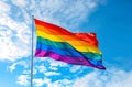 Generative AI. Rainbow Pride Flag Flying in the Sky. Happy Pride Month Concept Royalty Free Stock Photo