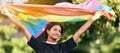 Rainbow, flag and gay pride with an indian woman in celebration of lgbt human rights alone outdoor. Freedom, equality Royalty Free Stock Photo