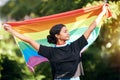 Rainbow, flag and human rights with an indian woman in celebration of lgbt gay pride alone outdoor. Freedom, equality Royalty Free Stock Photo