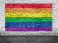 Rainbow flag painted over white brick wall Royalty Free Stock Photo