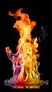 Rainbow flames shine in the dark Royalty Free Stock Photo