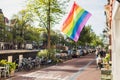 Rainbow gay pride flag in Amsterdam, Netherlands. Popular travel destination in Europe.