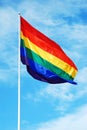 Rainbow gay pride flag on the blue sky Royalty Free Stock Photo