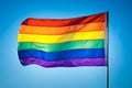 Rainbow Gay Pride Flag on blue sky background, Miami Beach Royalty Free Stock Photo