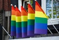 Rainbow gay pride flag on building exterior in Amsterdam Royalty Free Stock Photo