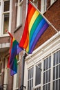 Rainbow gay pride flag on building exterior in Amsterdam Royalty Free Stock Photo