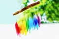 Rainbow glass wind chimes or windchime on nature background. Feng shui symbol. Copy space Royalty Free Stock Photo