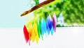 Rainbow glass wind chimes or windchime on nature background. Feng shui symbol. Copy space, 16:9 format Royalty Free Stock Photo