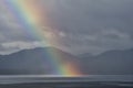 A rainbow going down on the Alaskan Sea