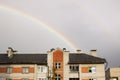 Rainbow in the gray sky over the rooftops Royalty Free Stock Photo
