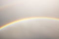 Rainbow in the gray sky over the rooftops Royalty Free Stock Photo