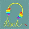 Rainbow headphones with cord in shape of word rock. Blue background. Music card. Royalty Free Stock Photo