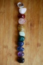 Rainbow Healing Crystals on wood table. Natural lighting with macro lens, rainbow stones. Clear Quartz, Pink Calcite, Jasper, Calc Royalty Free Stock Photo