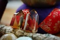 Rainbow Healing Crystals on wood table. Natural lighting with macro lens, rainbow stones. Tibetan Signing Bowl, romantic setting Royalty Free Stock Photo