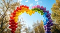 Rainbow Heart Balloons Arching Under Autumn Sky Royalty Free Stock Photo