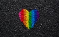 Rainbow heart on black background, gravel and shingle, LGBT colors, love wallpaper, valentine Royalty Free Stock Photo