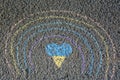 Rainbow with heart drawn by blue and yellow chalk on asphalt, top view Royalty Free Stock Photo