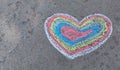 Rainbow heart drawn with chalk on the asphalt. love confession. banner place for text, valentine, children creativity copy space, Royalty Free Stock Photo