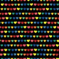 Rainbow hearts hand drawn on a black background. Vector seamless pattern. Blue green orange yellow pink red handmade hearts in a Royalty Free Stock Photo