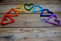 rainbow hearts on a wooden pattern