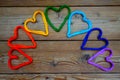 rainbow hearts on a wooden pattern