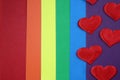 Rainbow homosexual color background with red hearts