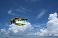 Rainbow house back on blue sky white cloud Royalty Free Stock Photo