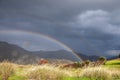 Rainbow in an idyllic mountain landscape Royalty Free Stock Photo