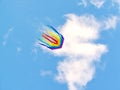 The rainbow kite flies in blue sky Royalty Free Stock Photo