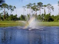 Rainbow in lake fountain on a golf course Royalty Free Stock Photo