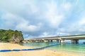 Rainbow landscape of the Shinto Shrine Naminoue at the top of a cliff overlooking the Naminoue beach and bridge of Naha City in Royalty Free Stock Photo