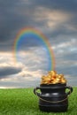 Rainbow leading to pot of gold Royalty Free Stock Photo